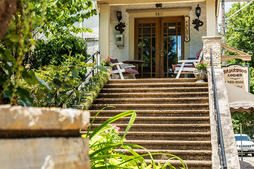 a staircase leading to a hotel entrance